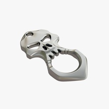 brass knuckles skull 3d print model in hand tools 3dexport knuckle-duster self-defence defense protection security kick attack cranium brainpan keychain sharp metallic steel safety 3d print model - Mito3D