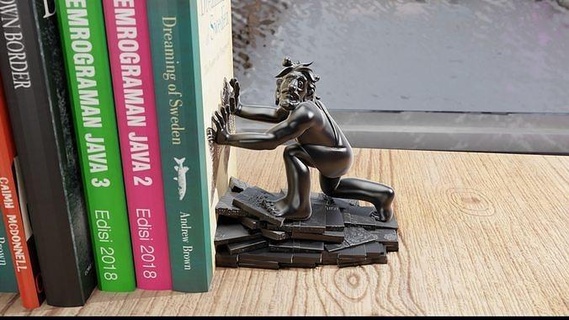 bookish cave dweller - literary guardian book holder books bookend stand home decor furniture caveman ancient hobby diy hand tools 3d print model - Mito3D
