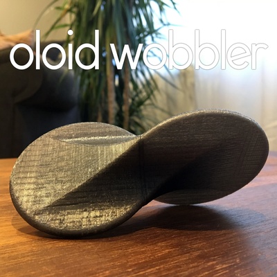 oloid wobbler rolling fidget desk toy 3d models download creality cloud 3d print model - Mito3D