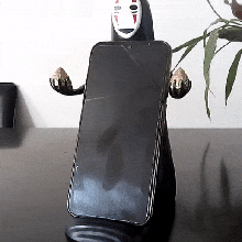 cell phone holder face faceless chihiro's journey cellular 3d model anime totoro 3d print model - Mito3D