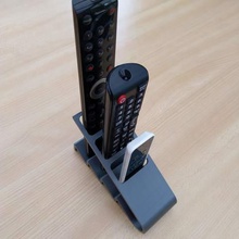 le design de la télécommande du téléviseur titulaire maison stand 3d print model - Mito3D
