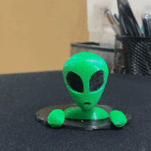 green alien art toy game decoration climbs space hole black universe 3d print model - Mito3D