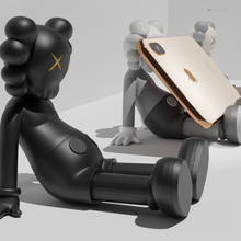 kaws cellphone holder - stand holiday taipei game mobile phone iphone accessories organizer character figure rockefeller center samsung 3d print model - Mito3D