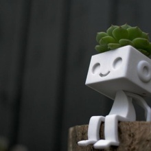 robbie robot sitting art succulent toy card holder cute planter 3d print model - Mito3D