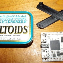 standoff bracket holding mini spartan 6 fpga board altoids tin tool electronics 3d print model - Mito3D