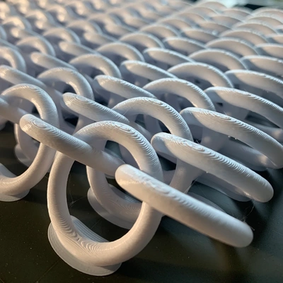 intertwining rings 3d printed chainmail stl a unique to printing model showcases power of printing is sheet creates chain mail print in place forever be intertwined download includes file needed own requires no additional tools 3d print model - Mito3D