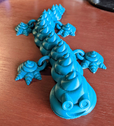 articulado cocô dragão fariculado turdragão remixado by cara brinquedos jogos articulando flexível brinquedo emoji criatura animal flexi 3d print model - Mito3D