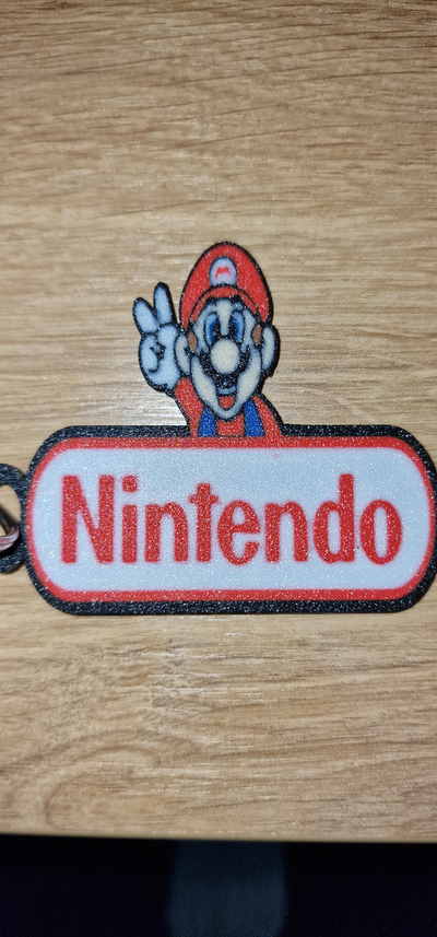 nintendo super mario logo keychain by nico91 art signs & logos mariobros supermario accessory sign 3d print model - Mito3D