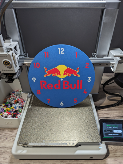 rouge taureau l'horloge by shanehoggatt ménage décor redbull énergie temps boisson ailes mur bleu jaune 3d print model - Mito3D