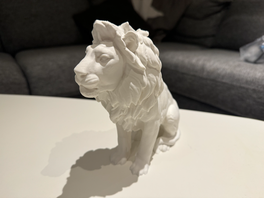 lion by stigern art sculptures figure figurine marble stone modl mold sitting africa safari desert hunter lionesse king bust decor decoration outside white matt home modern outdoor doorstep royal homeart homeaccessories guard door easy simple 3d print model - Mito3D