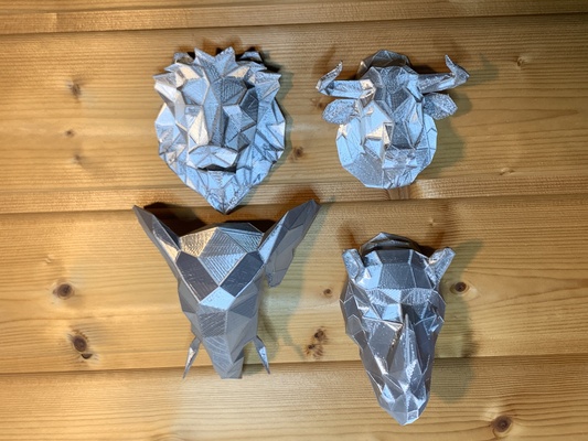 poly animal heads by pathfinder 133 art sculptures lowpoly head bull elephant lion rhino lowpolygon 3d print model - Mito3D