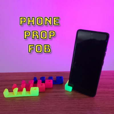 phone prop fob - stand selfie by makers mashup tools gadgets phonestand selfiestand phoneaccessory 3d 3dprint lanyard wriststrap 3d print model - Mito3D