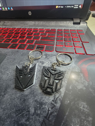 transformers keychains by galaxyprints fashion models keychain transformer autobot decepticon optimus prime megatron 3d print model - Mito3D