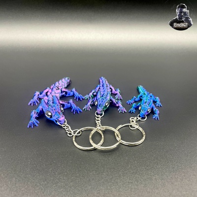 baby bull dragon keychain - flexi print in place no supports by endk7designs fashion models art articulated creature cute cuteanimal dragons easyprint fast fastprint flexible jewelry keychains pendant printinplace 3d print model - Mito3D