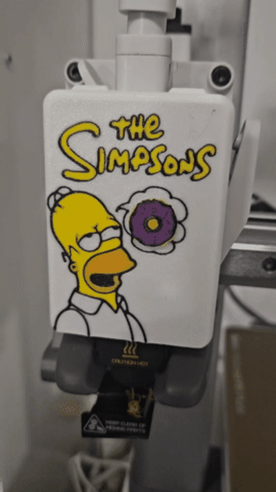 homère simpson donut a1 plaque frontale couverture gaine by épée noire créations 3d imprimante pièces simpsons a1mini fenêtre extrudeuse équipement tête d'outil boîte outils douane fanart hommage 3d print model - Mito3D