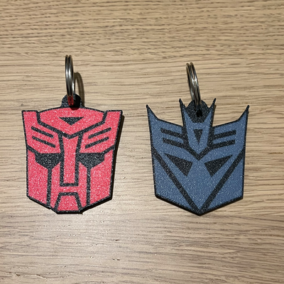 transformers keychain autobot vs decepticon by 3dingo props & cosplays portachiavi contro gadget war machine machines cosplay keyring hasbro takara tomy takaratomy reverse print reverseprint 3d print model - Mito3D