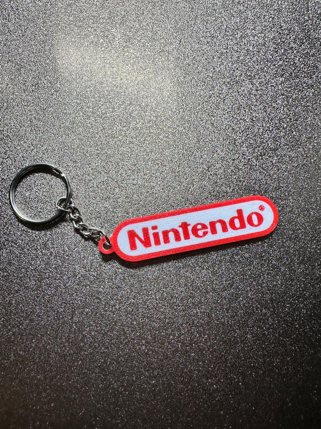 nintendo logo llavero by luciano brek herramientas artilugio nintendo blanco rojo 3D print model - Mito3D