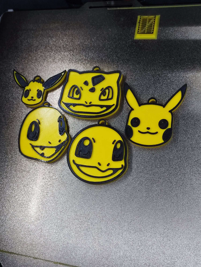 pok lun porte clés by fikuss30 art monnaie badges pokémon pikachu charmander évoli bulbasaur gicler 3d print model - Mito3D