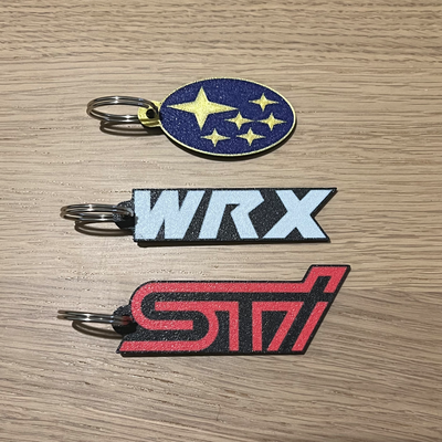 subaru wrx sti schlüsselbund portachiavi by 3dingo hobby diy fahrzeuge gadget auto wagen fahrzeug maschine zubehör accessori logo schlüsselring umkehren umkehrdruck drucken schlüsselhalter 3d print model - Mito3D