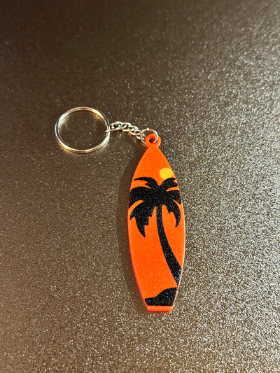 surfboard keychain by lucianobrek tools gadgets surf sun sunset palm orange yellow black 3d print model - Mito3D