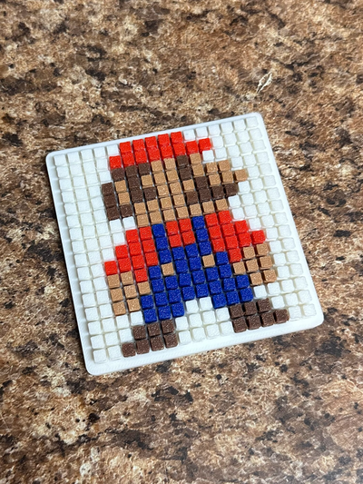 mario pixel puzzle desktop ausführung by abonnieren generativ 3d modell hersteller büro zubehör schreibtisch zubehörteil rot blau braun weiß dekor spaß stücke klein kinder video spiel einfach 3d print model - Mito3D