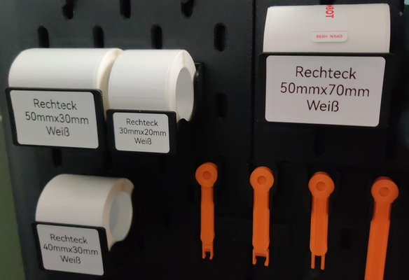 niimbot roll holder skadis hooks labels remixed by raphratz tools organizers label ikea mount 3d print model - Mito3D