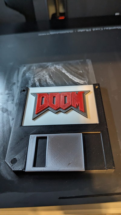 untergang diskette scheibe koloriert logo gedreht neu gemischt by videoanleitung kunst zeichen logos dos 3d print model - Mito3D