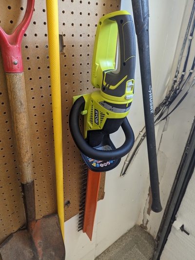 ryobi hedge trimmer mount labeled remixed by thibo-do-it tools wall holder 3d print model - Mito3D