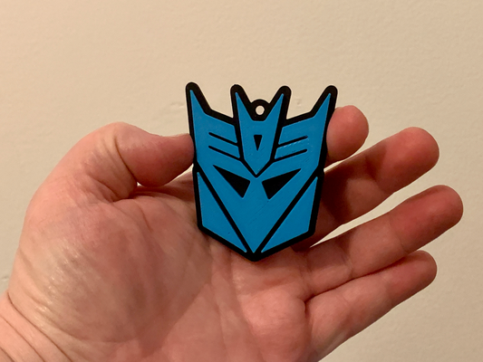 transformers decepticons keychain - two color print filament swap at layer height no ams needed by lilac rage art signs & logos autobots transformer decepticon autobot logo key chain keyring ring 3d print model - Mito3D