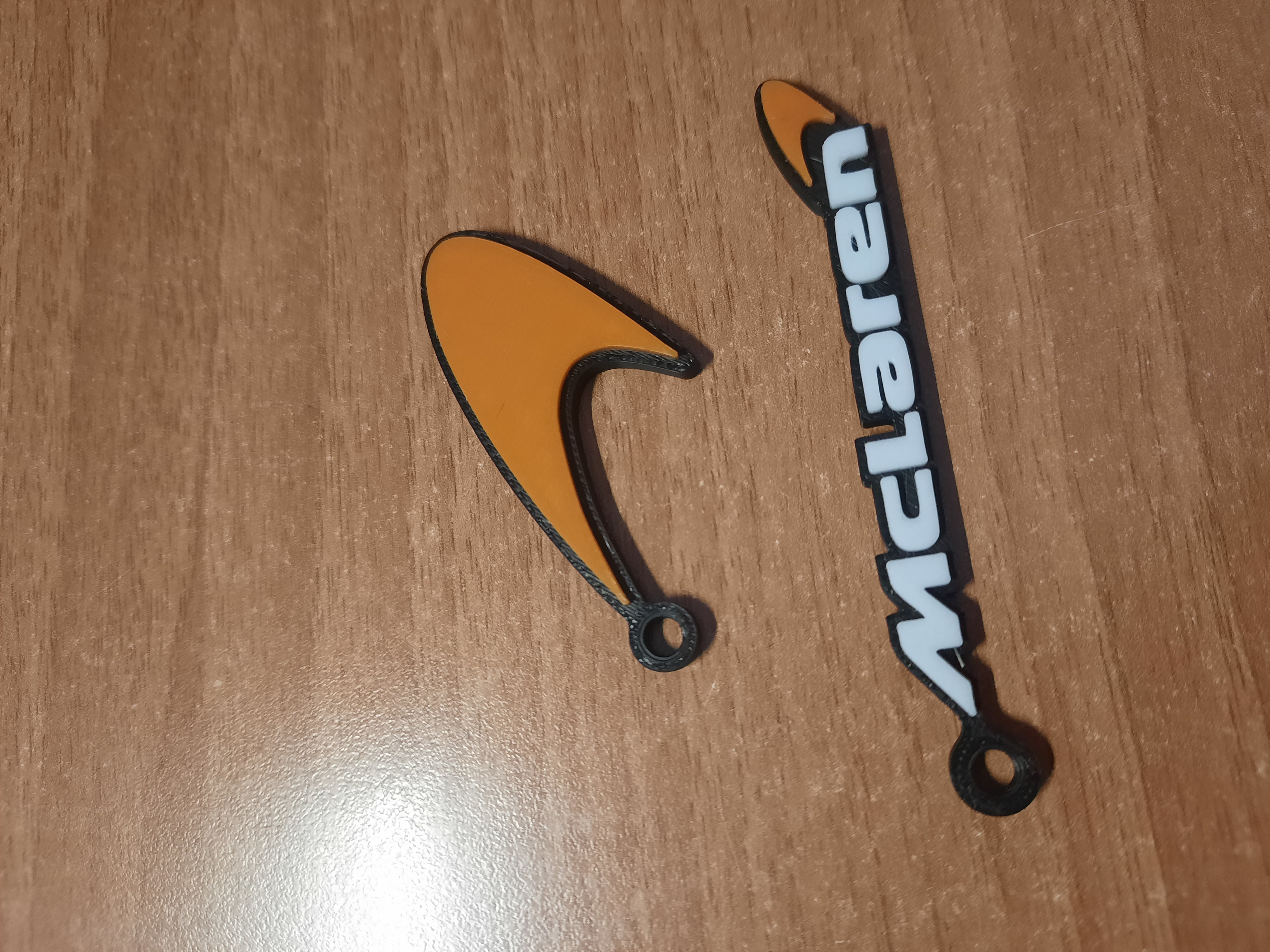 mclaren logo keychain by luke-leek-98 art signs & logos white black car orange formula1 f1 keychains england mclarenf1 norris piastri papaya 3D print model - Mito3D