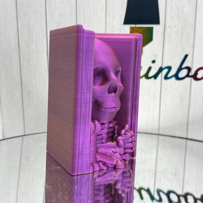 skeleton in book by rainbowhairdesigns household decor halloween spooky 3d print model - Mito3D