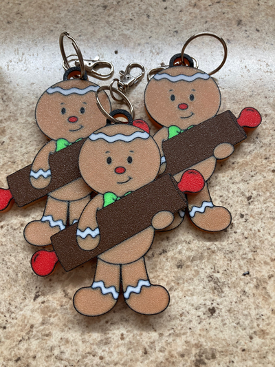 gingerbread boy holding rolling pin keychain or ornament by etribke holiday christmas 3d print model - Mito3D