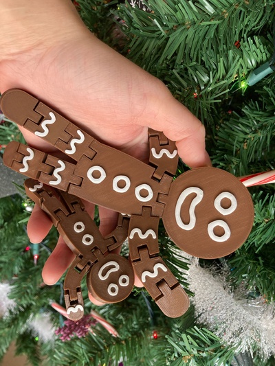 articulated print in place gingerbread men by penolopybulnick household decor toy christmas ornament gingerbreadman tinkercad instructables printinplace 3d print model - Mito3D