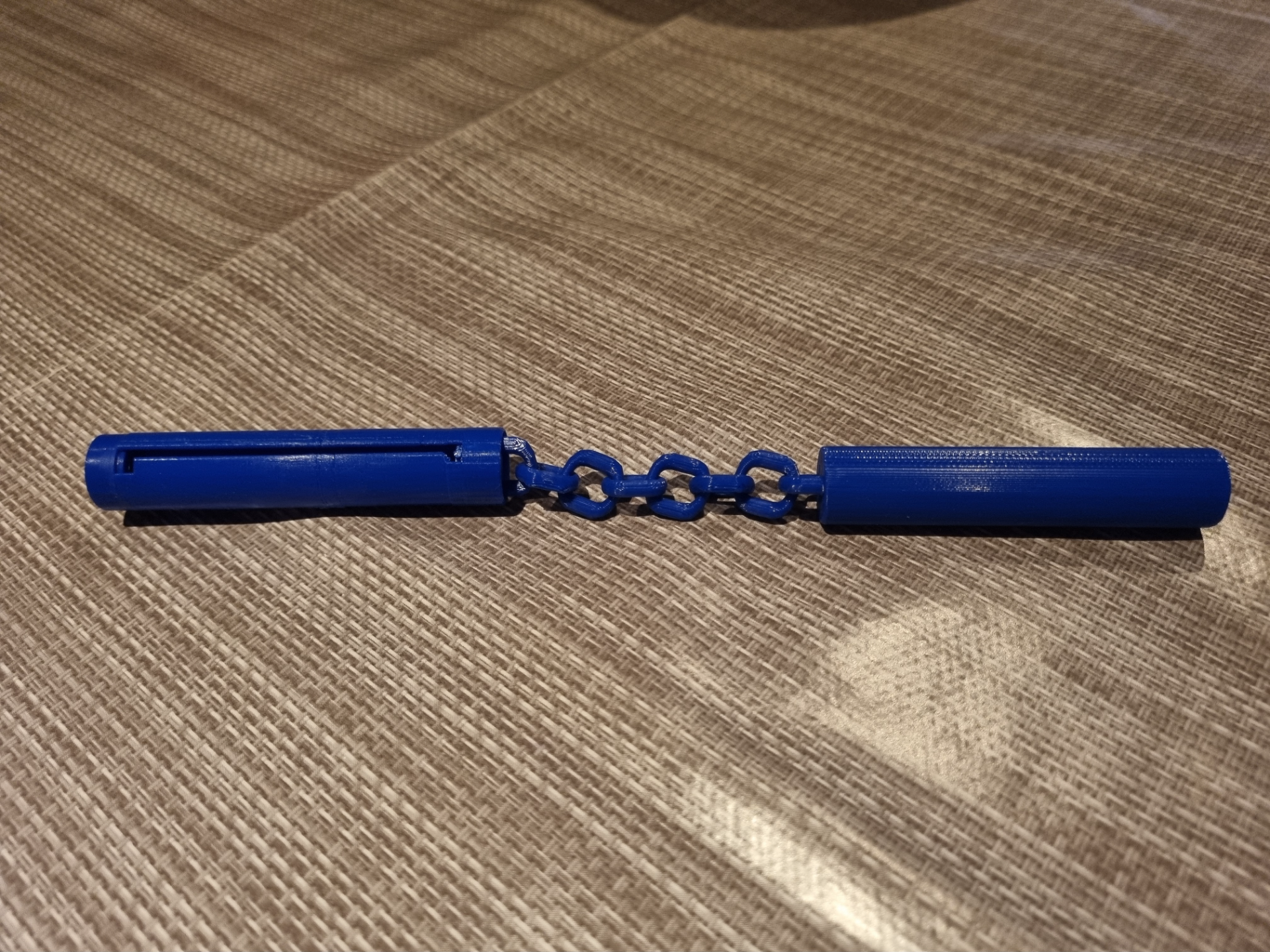 flexi agitarse nunchucks by aficionado huellas dactilares juguetes juegos juguete nunchuck arma 3D print model - Mito3D