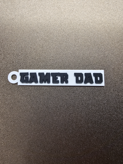 gamer dad keychain by geeklabs art coin & badges player game daddy fun parent family child on key chain tag badge parenting pc playstation console xbox steam 3d print model - Mito3D