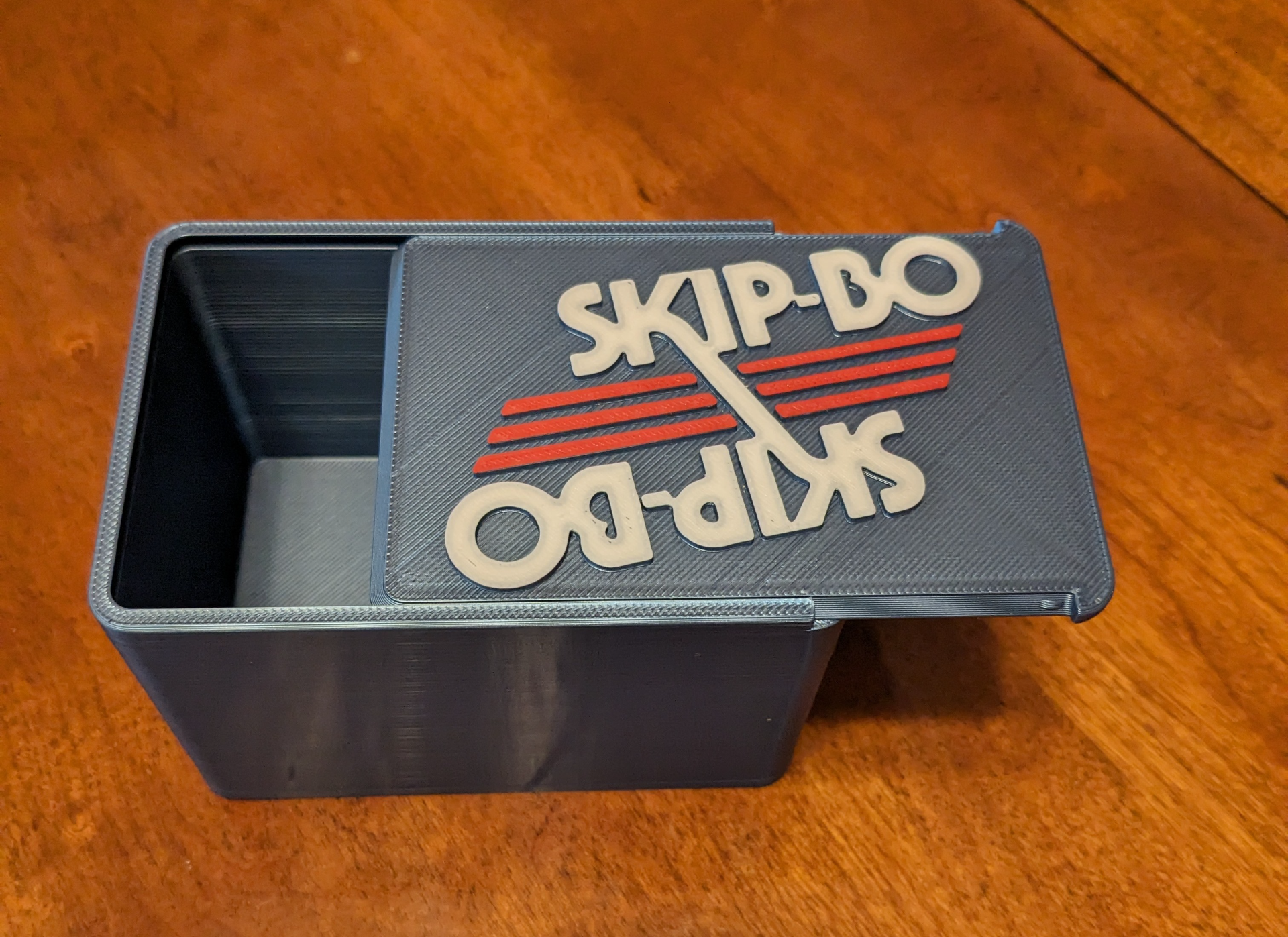 skip-bo card box remixed by tsuckow toys & games board skipbo old logo 3D print model - Mito3D