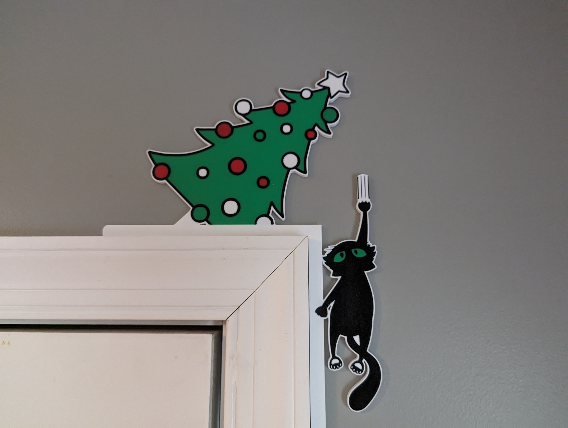 catastrophe christmas door hanger falling kitty cat left by dakjones82 art 2d 2023 funny holiday decor decoration wall 3D print model - Mito3D