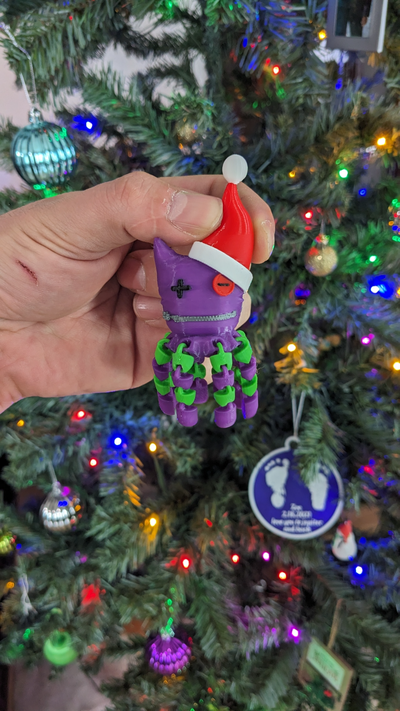 okto santa by stehaufmunter haushalt dekor weihnachten tintenfisch scheiße erica schlachten ornament hut flexi spielzeug 3d print model - Mito3D