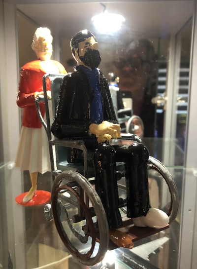 captain haddock in a wheelchair pushed by bianca pinshape 3d print model - Mito3D