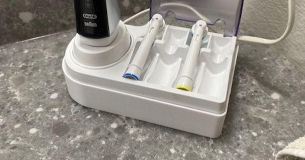 oral-b tooth brush holder & cord concealer ray download free stl model printablescom 3d models household bathroom electrictoothbrush toothbrushholder 3d print model - Mito3D