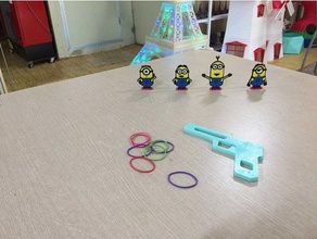 rubber gun toy game accessories monions rebbergun rhea systemrhea 3d print model - Mito3D