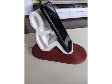 phone stand sitting man charge 3d nobbi 3d print model - Mito3D